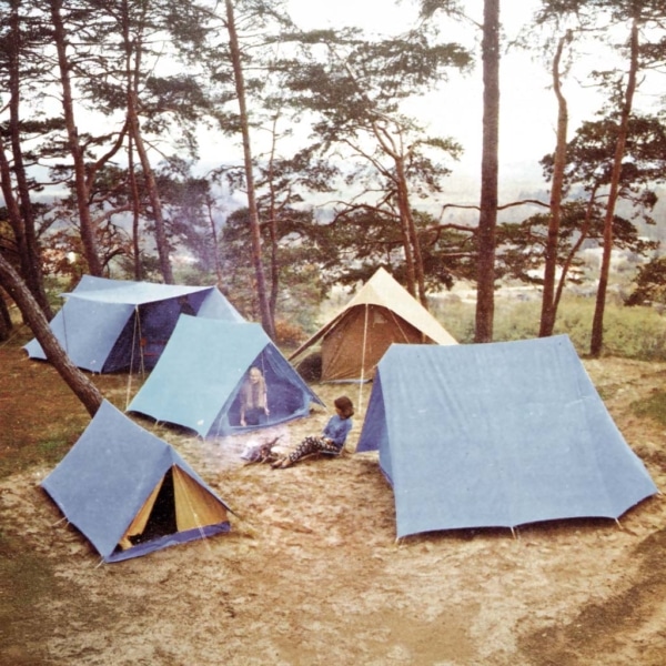 Patrouille tent pitched in a forest setting.