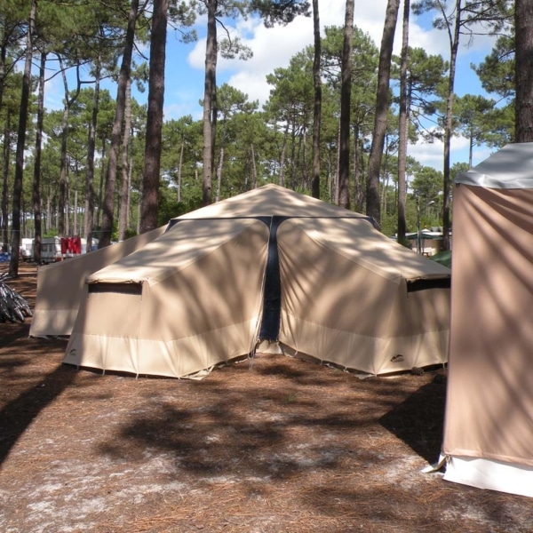 Spacious interior of the Tente de Soleil with central activity area.