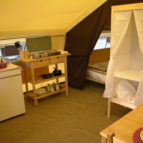 Interior of Classic 400 Permanent tent with two separate bedrooms and large windows.