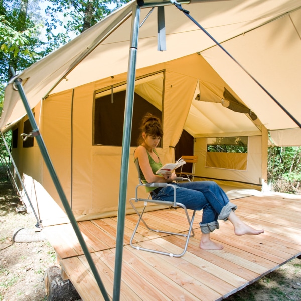 Family glamping tent Classic 500 with electric hub, stove, and full furnishings.