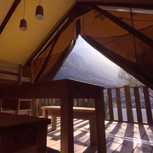 The Crusoe XL Tent offers all-season comfort with a wooden frame and breathable canvas – perfect for stylish family glamping and permanent eco-camps.