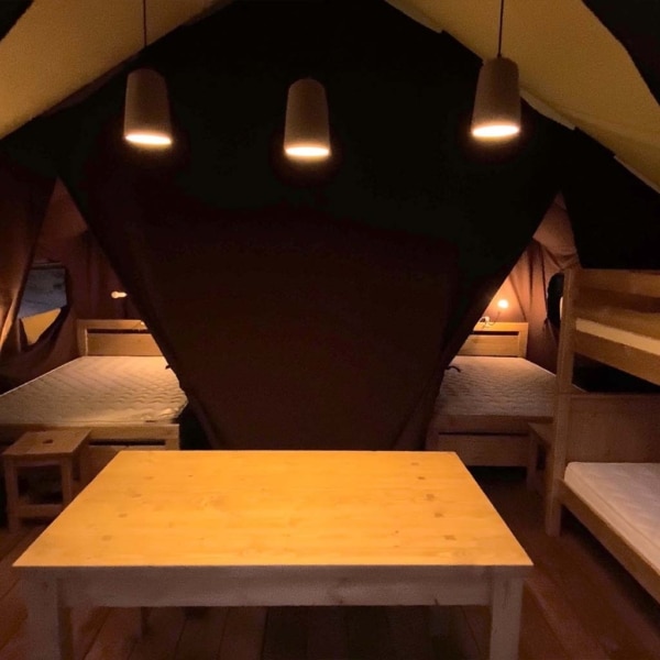 The Crusoe XL Tent offers all-season comfort with a wooden frame and breathable canvas – perfect for stylish family glamping and permanent eco-camps.
