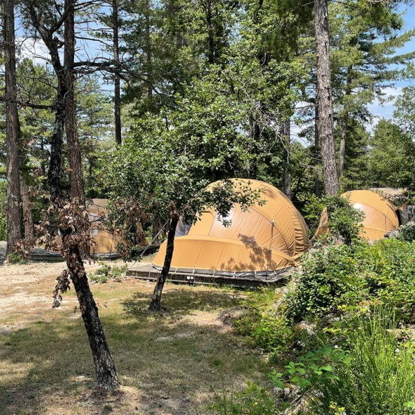 Luxury canvas tent with natural light, easy framing, and weather-resistant design.