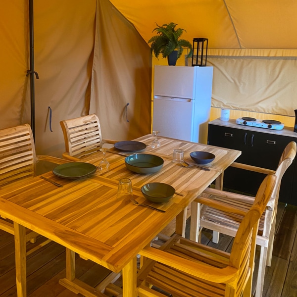 Interior view of the Maasai tent featuring natural light and elegant finishes.