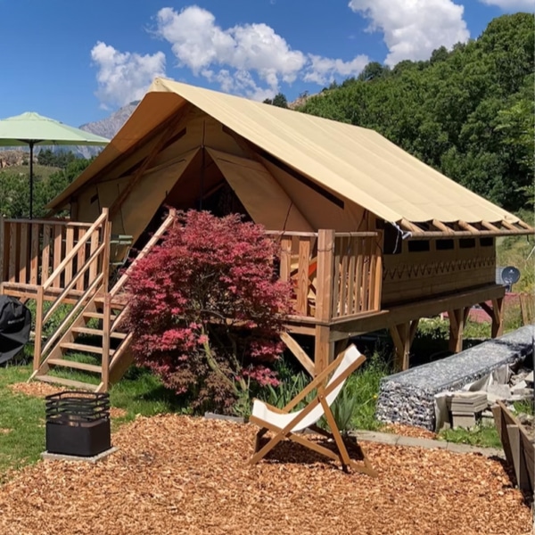 Vendredi glamping tent with two bedrooms and spacious living area.